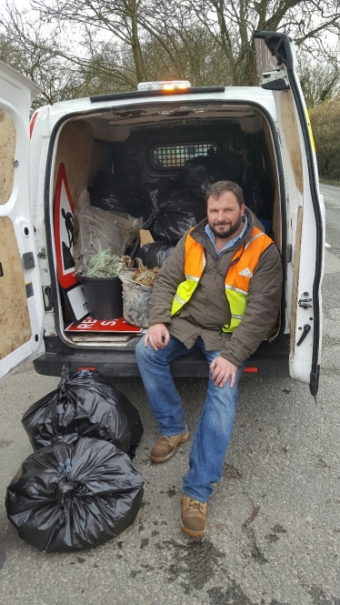 Collecting bags of rubbish